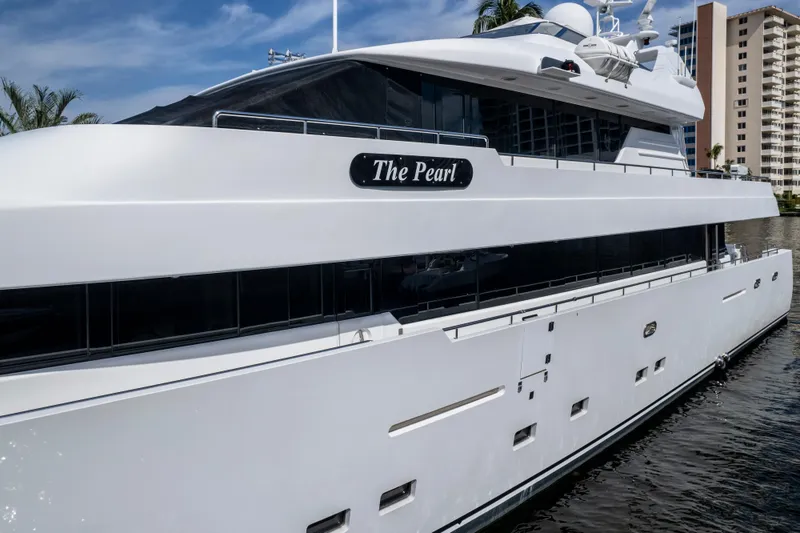 Slide: The Image of Luxury yacht "The Pearl," Intermarine 118, 1998 model, docked near waterfront buildings. - 10