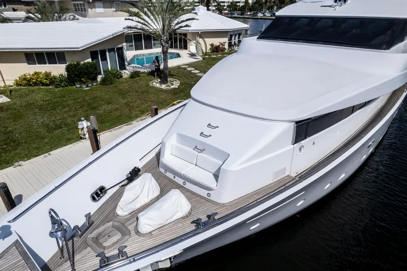 Slide: The Image of Luxury 1998 Intermarine 118 yacht docked near waterfront home. - 12