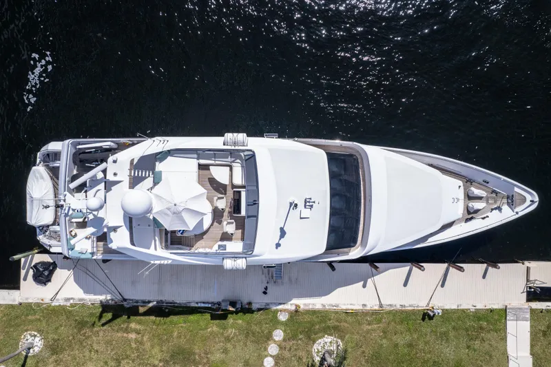 Slide: The Image of Aerial view of 1998 Intermarine 118 yacht docked by the water. - 15