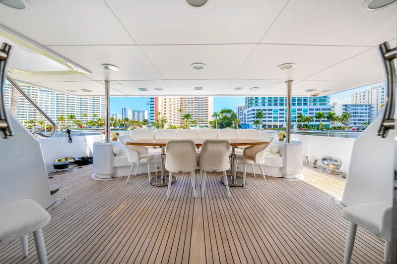 Slide: The Image of Spacious deck of 1998 Intermarine 118 yacht with elegant dining area. - 16