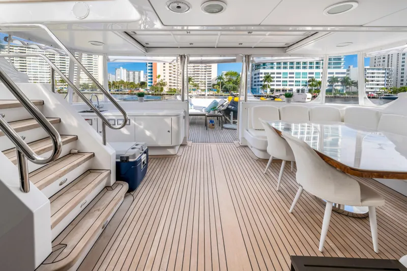 Slide: The Image of Luxurious 1998 Intermarine 118 yacht interior with elegant seating and wooden flooring. - 19