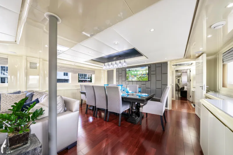 Slide: The Image of Luxurious dining area on 1998 Intermarine 118 yacht with elegant decor and hardwood flooring. - 21