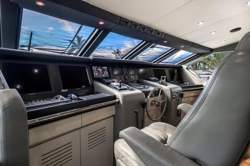 Slide: The Image of Luxurious 1998 Intermarine 118 yacht cockpit with advanced navigation systems and plush seating. - 29