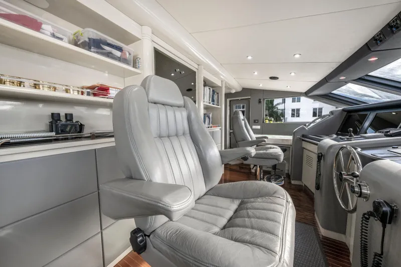 Slide: The Image of Luxurious 1998 Intermarine 118 yacht interior with plush seating and modern helm controls. - 30