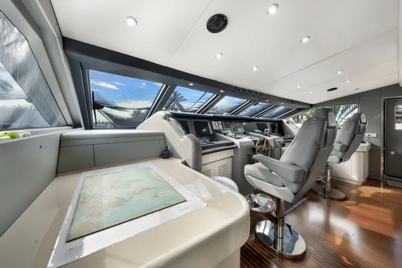Slide: The Image of Luxurious 1998 Intermarine 118 yacht cockpit with modern navigation equipment and sleek design. - 31