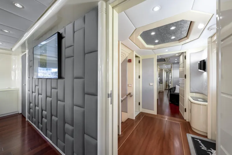 Slide: The Image of Luxurious interior of 1998 Intermarine 118 yacht with modern design and wood flooring. - 32