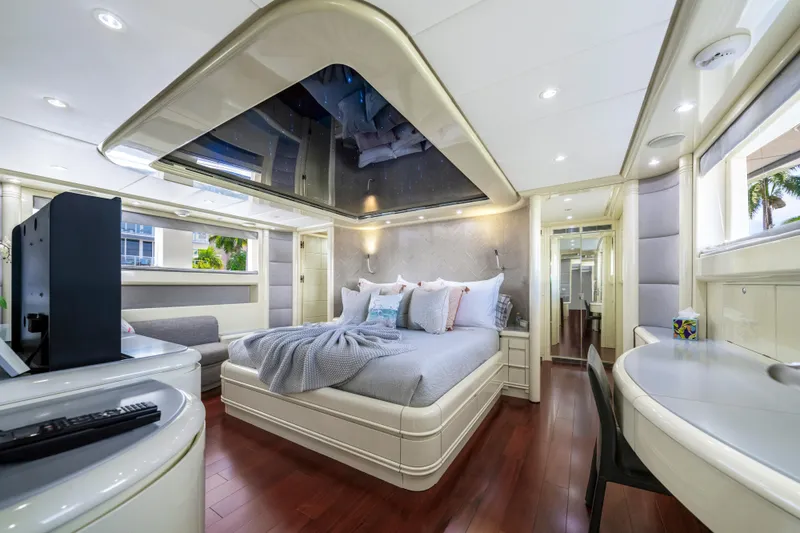 Slide: The Image of Luxurious bedroom interior of 1998 Intermarine 118 yacht with modern decor and wood flooring. - 38