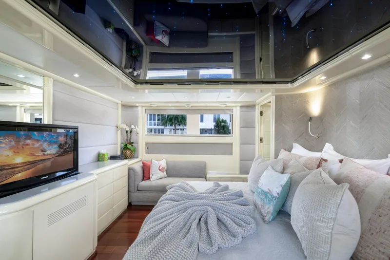 Slide: The Image of Luxurious bedroom interior of 1998 Intermarine 118 yacht with modern decor and cozy bedding. - 40