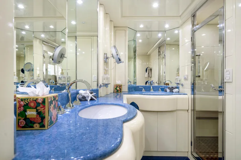 Slide: The Image of Luxurious bathroom with blue countertop in 1998 Intermarine 118 yacht. - 43