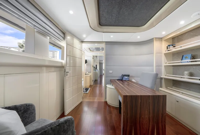 Slide: The Image of Luxurious interior of 1998 Intermarine 118 yacht with modern furnishings and wood accents. - 48
