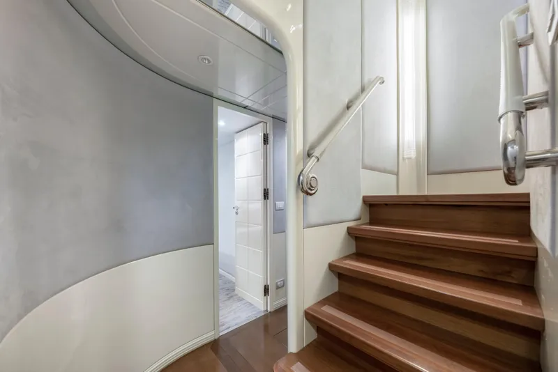 Slide: The Image of Interior staircase of 1998 Intermarine 118 yacht with modern design and wooden steps. - 50