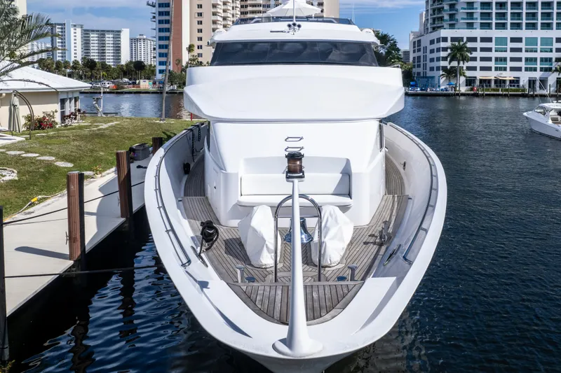 Slide: The Image of Luxury 1998 Intermarine 118 yacht docked in a marina, surrounded by modern buildings. - 7