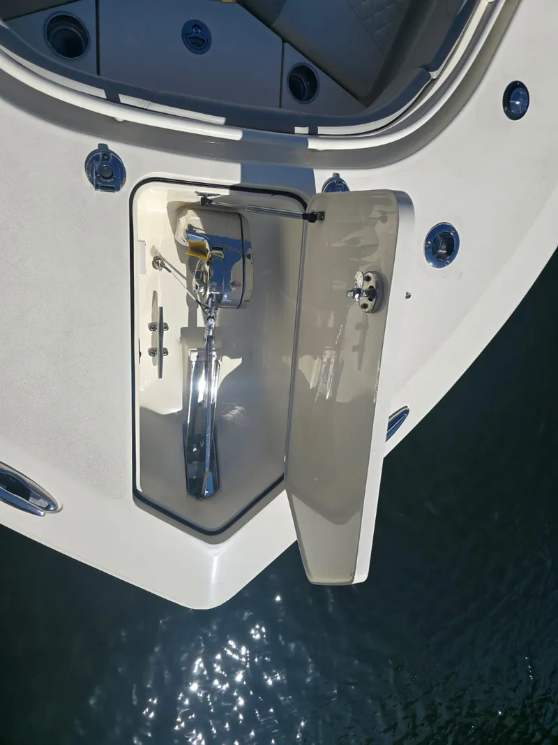 Slide: The Image of 2024 Scout 355 LXF boat anchor compartment, open hatch, viewed from above. - 13