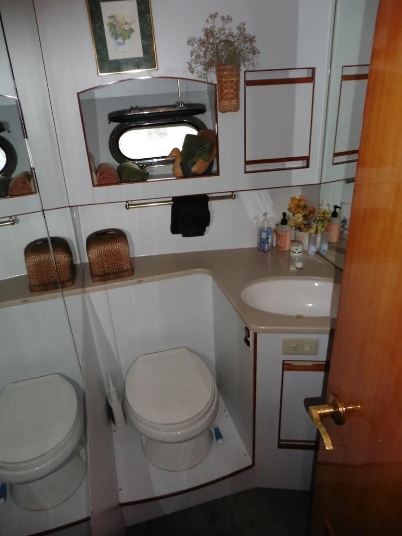 Slide: The Image of Bathroom interior of 2000 Novatec Cockpit Motor Yacht with sink and toilet. - 18