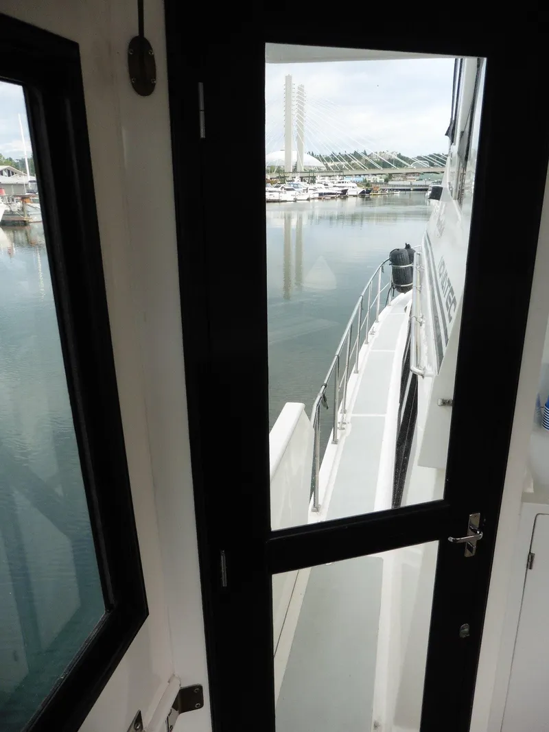Slide: The Image of Novatec Cockpit Motor Yacht 2000, view from cabin door overlooking marina. - 26