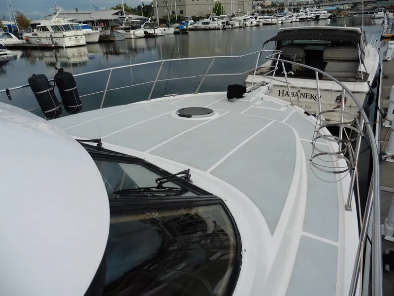 Slide: The Image of Novatec Cockpit Motor Yacht 2000 docked in marina, showcasing spacious deck and sleek design. - 30
