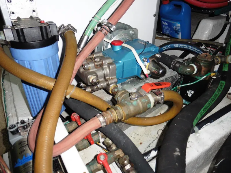 Slide: The Image of Engine room of 2000 Novatec Cockpit Motor Yacht with hoses and machinery. - 36