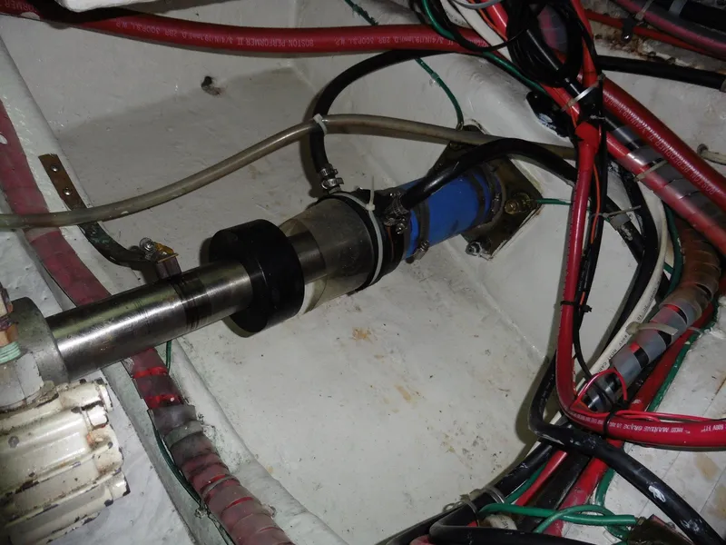 Slide: The Image of Engine compartment of a 2000 Novatec Cockpit Motor Yacht with visible wiring and components. - 37