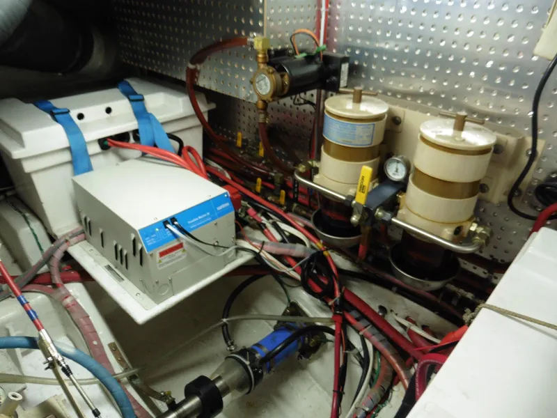 Slide: The Image of Engine room of 2000 Novatec Cockpit Motor Yacht with fuel filters and electrical components. - 39