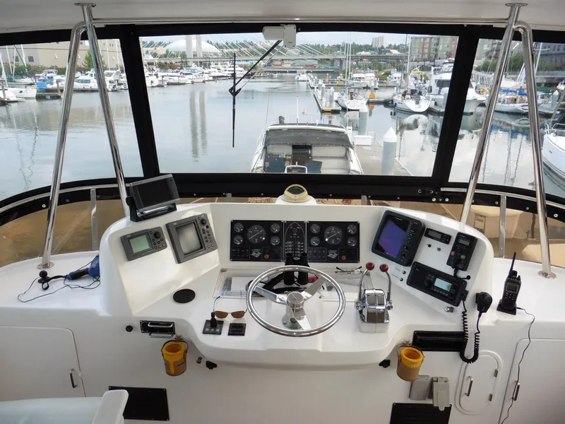Slide: The Image of Cockpit view of 2000 Novatec Motor Yacht with marina in background. - 40