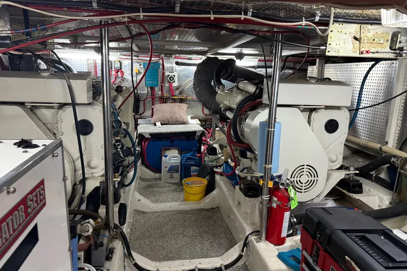 Slide: The Image of Engine room of 2000 Novatec Cockpit Motor Yacht with visible machinery and equipment. - 50