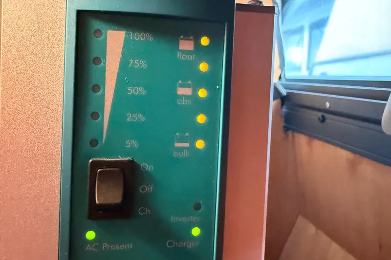 Slide: The Image of Control panel of a 2000 Novatec Cockpit Motor Yacht, showing battery charge levels. - 51