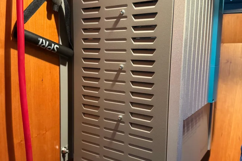 Slide: The Image of Ventilated panel inside a 2000 Novatec Cockpit Motor Yacht, featuring red and black cables. - 52