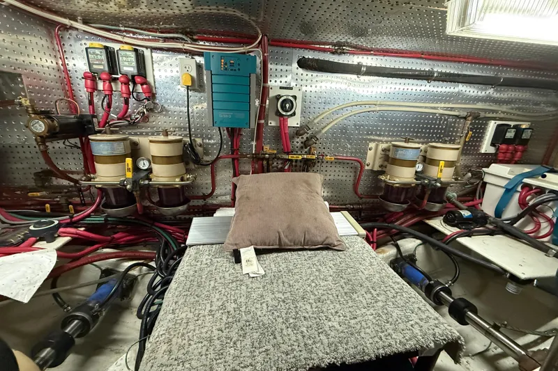 Slide: The Image of Engine room of 2000 Novatec Cockpit Motor Yacht with mechanical components and wiring. - 56