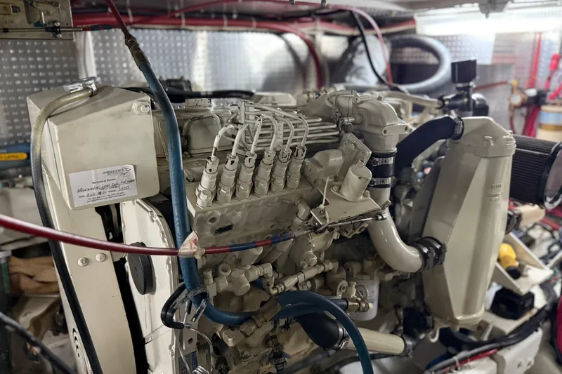 Slide: The Image of Engine room of a 2000 Novatec Cockpit Motor Yacht, showcasing detailed machinery. - 57