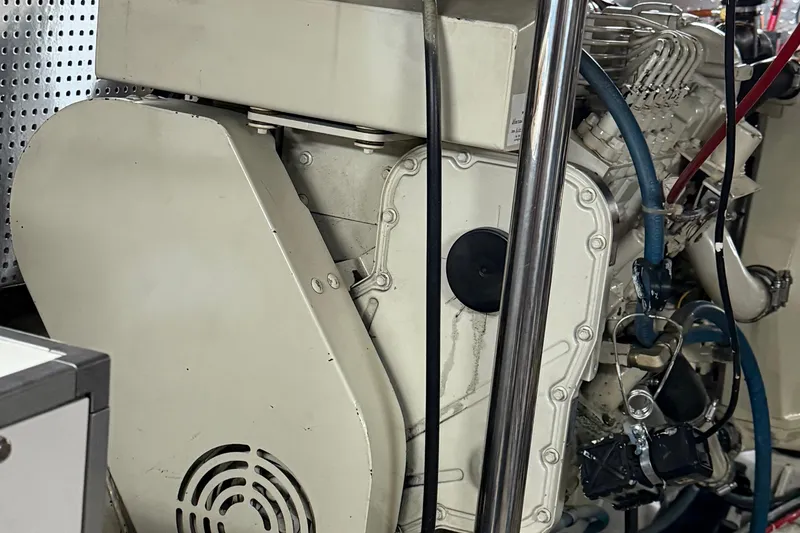 Slide: The Image of Engine room of a 2000 Novatec Cockpit Motor Yacht, showcasing mechanical components. - 58