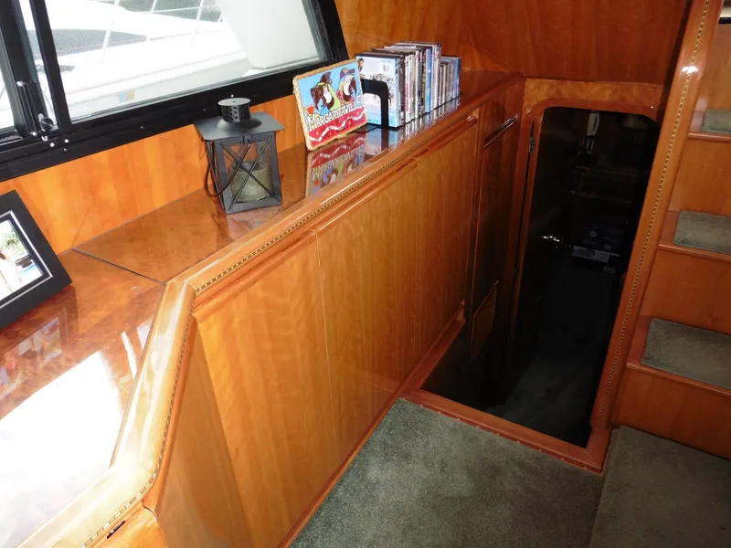 Slide: The Image of Interior of 2000 Novatec Cockpit Motor Yacht with wooden cabinetry and staircase. - 6