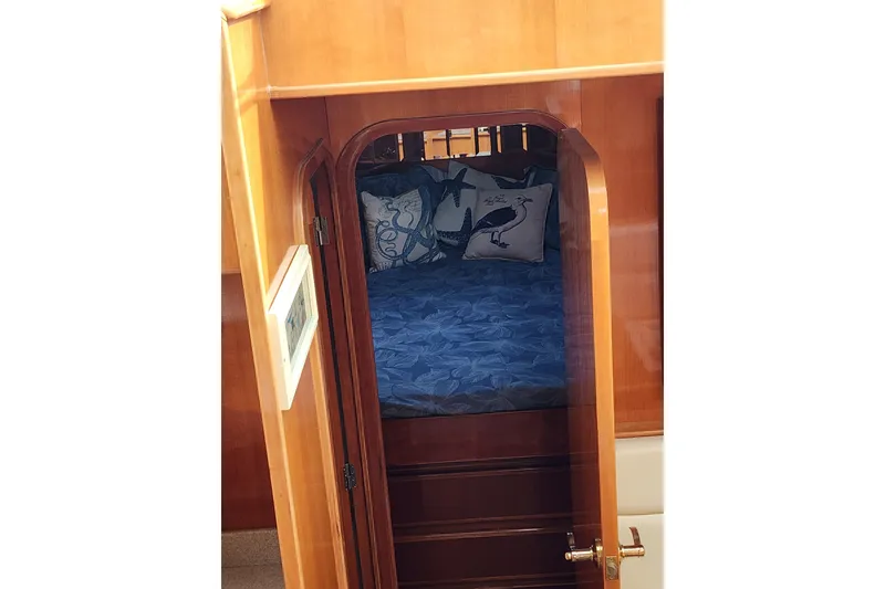 Slide: The Image of Interior cabin view of 2000 Novatec Cockpit Motor Yacht with nautical-themed bedding. - 60