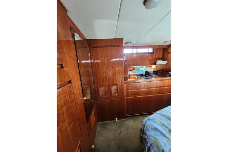Slide: The Image of Interior of 2000 Novatec Cockpit Motor Yacht with wooden cabinetry and cozy furnishings. - 64