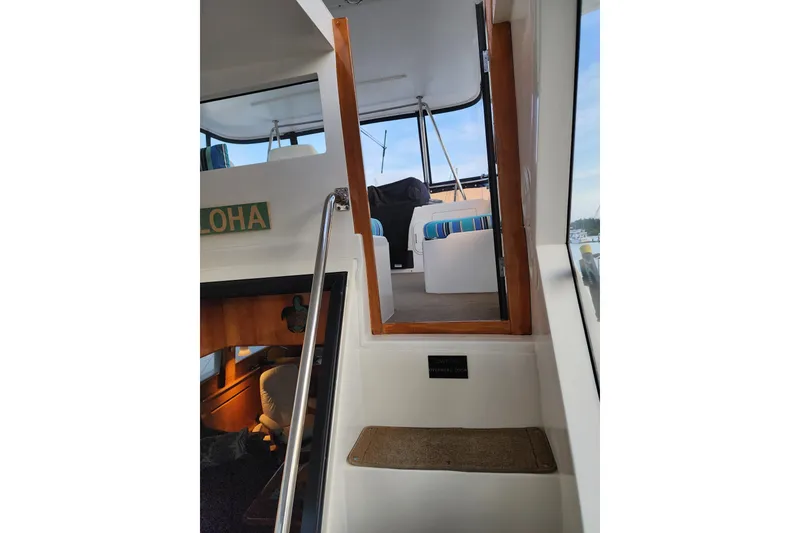 Slide: The Image of Stairway inside 2000 Novatec Cockpit Motor Yacht with cozy seating area. - 67