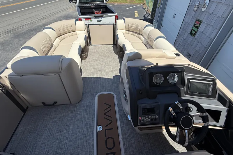 Slide: The Image of Interior of 2026 Avalon 2385 Catalina Quad Lounger, featuring a modern helm and luxurious seating. - 13