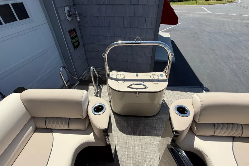 Slide: The Image of Interior of 2026 Avalon 2385 Catalina Quad Lounger, featuring luxurious seating and modern dashboard. - 23