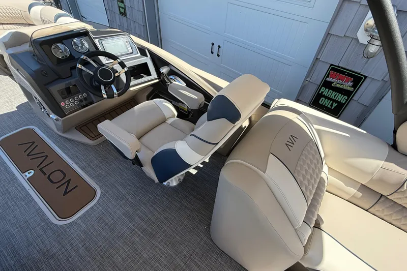Slide: The Image of 2026 Avalon 2385 Catalina Quad Lounger dashboard with steering wheel and controls. - 24