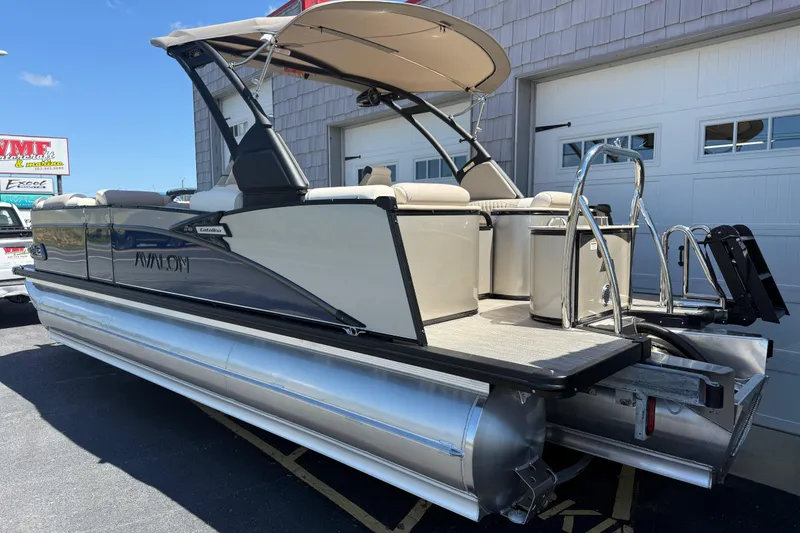 Slide: The Image of 2026 Avalon 2385 Catalina Quad Lounger Tri Toon, rear view with ladder and seating. - 6