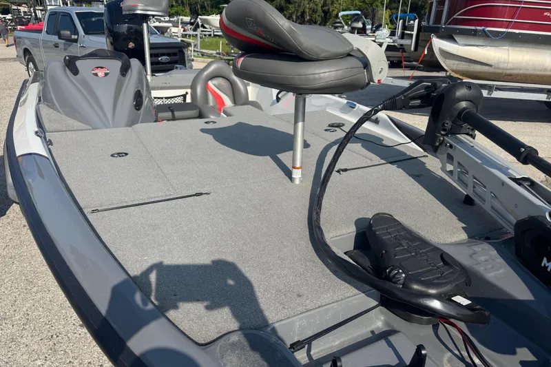 Slide: The Image of 2021 Bass Cat Margay fishing boat with seating and trolling motor on deck. - 23