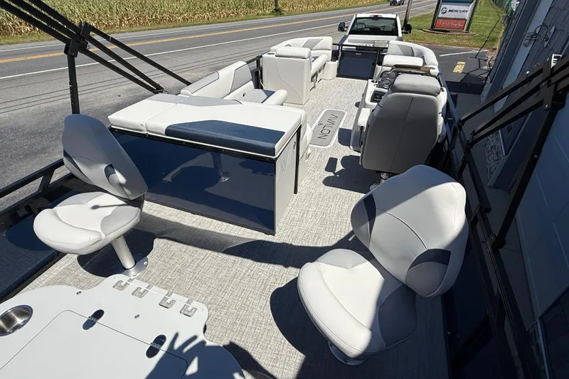 Slide: The Image of 2025 Avalon 2385 Venture 85 Tri Toon boat interior with plush seating and modern design. - 12