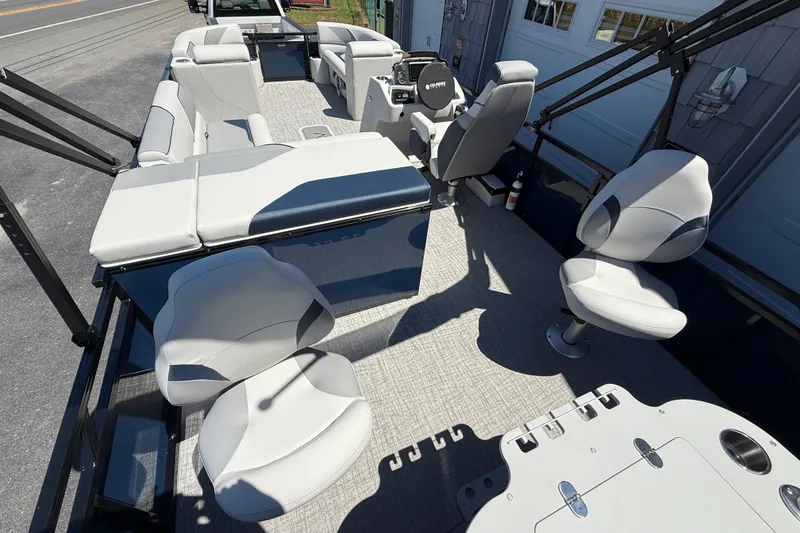 Slide: The Image of 2025 Avalon 2385 Venture 85 Tri Toon boat interior with modern seating and fishing setup. - 13