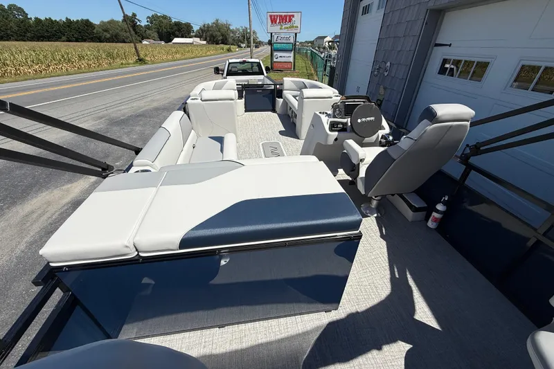 Slide: The Image of 2025 Avalon 2385 Venture 85 Tri Toon boat with spacious seating and modern design. - 14