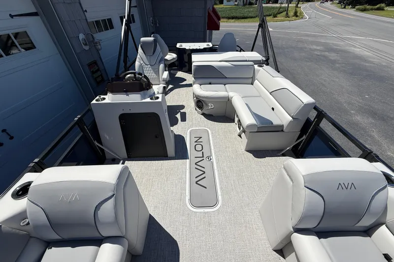 Slide: The Image of 2025 Avalon 2385 Venture 85 Tri Toon boat interior with luxurious seating and modern design. - 18