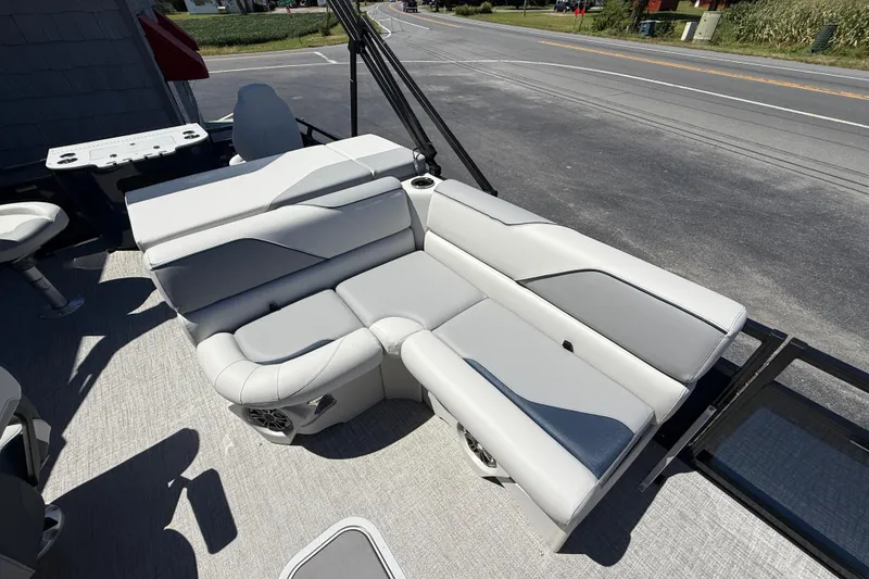 Slide: The Image of 2025 Avalon 2385 Venture 85 Tri Toon boat with luxurious seating and high-performance design. - 19