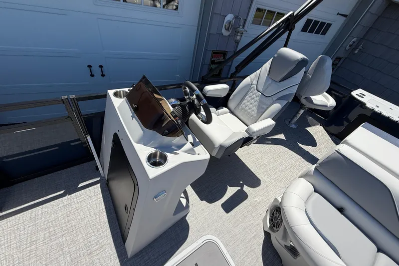 Slide: The Image of 2025 Avalon 2385 Venture 85 Tri Toon boat interior with modern helm and seating. - 20