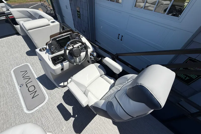 Slide: The Image of 2025 Avalon 2385 Venture 85 Tri Toon boat interior with modern helm and seating. - 22