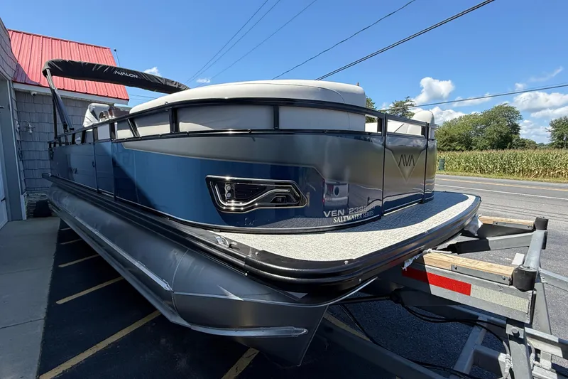 Slide: The Image of 2025 Avalon 2385 Venture 85 Tri Toon boat on trailer, high performance design. - 9