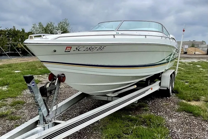 Slide: The Image of 1999 Formula 271 FASTech boat on trailer, parked outdoors on grassy area. - 14