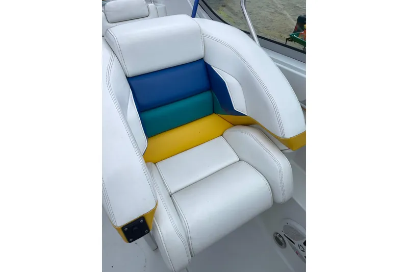 Slide: The Image of White and multicolored seat in 1999 Formula 271 FASTech boat interior. - 23
