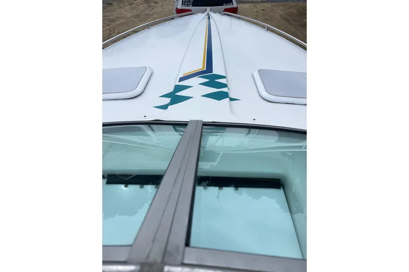 Slide: The Image of 1999 Formula 271 FASTech boat with sleek design and geometric graphics. - 24